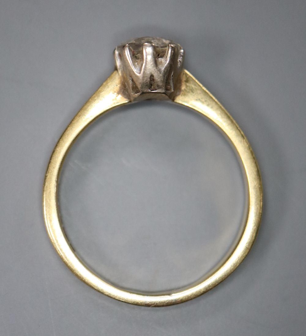 A modern 18ct gold and solitaire diamond ring, size M, gross 2.9 grams,